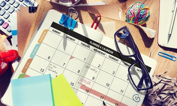 desk with agenda calculator to manage personal branding when working from home