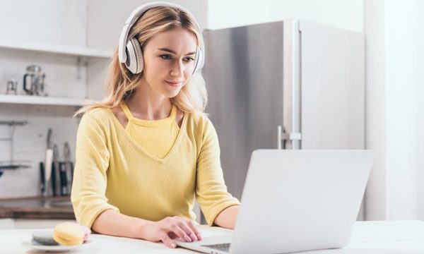 woman working from home during summer vacation doing virtual education