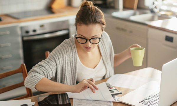 woman at home trying to figure out how to start business