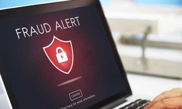 laptop with the words fraud alert for how to avoid work at home jobs