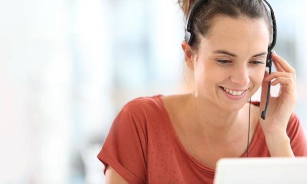 work at home woman talking to customer on the other line