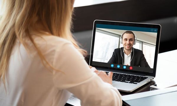 woman performing virtual interviews
