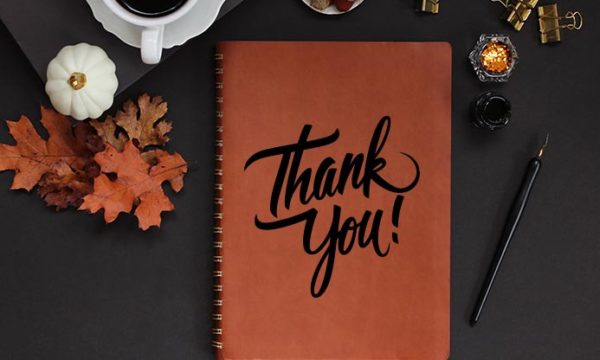 thanksgiving holiday table with notebook for work at home agents