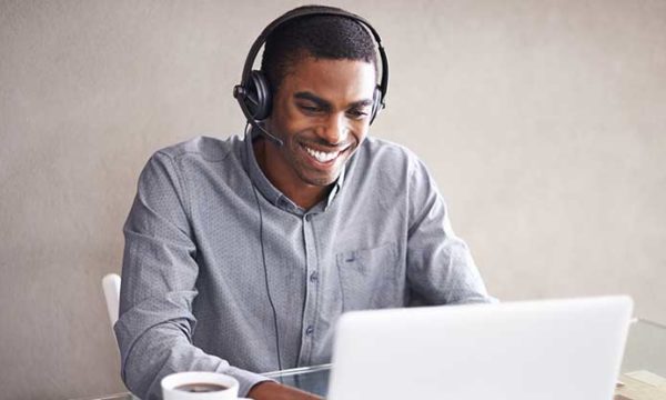 man working from home using laptop