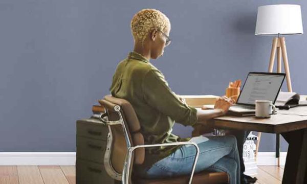 woman with busy mom schedule works from home to make extra money