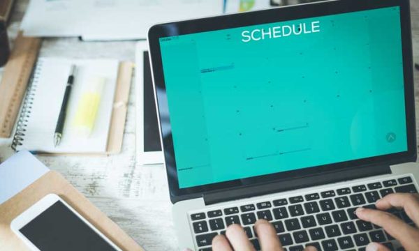 looking at computer screen with schedule open