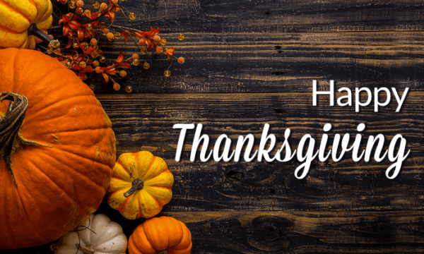 happy thanksgiving with pumpkin and table background