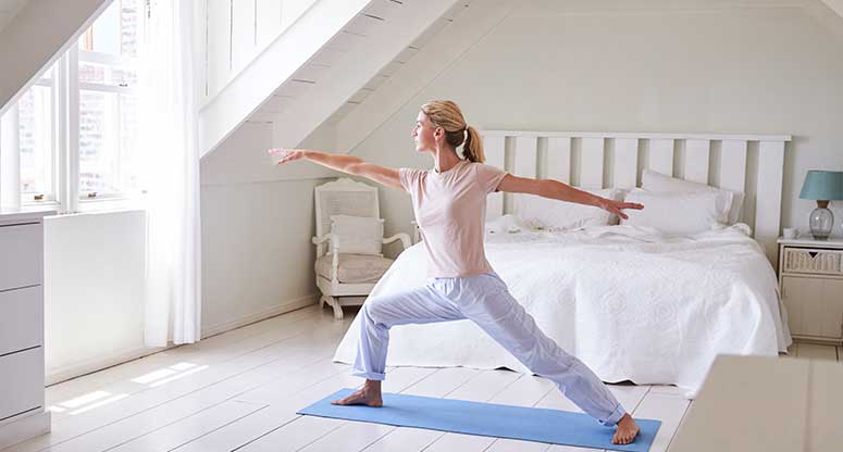 woman doing morning exercises before working from home
