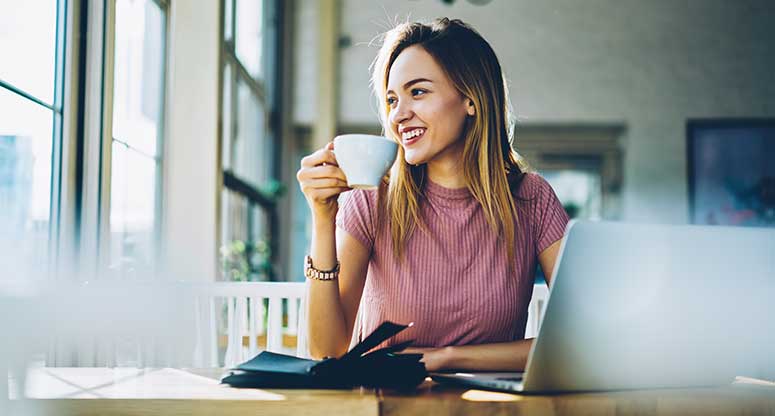 woman drinking coffee when starting the day working from home