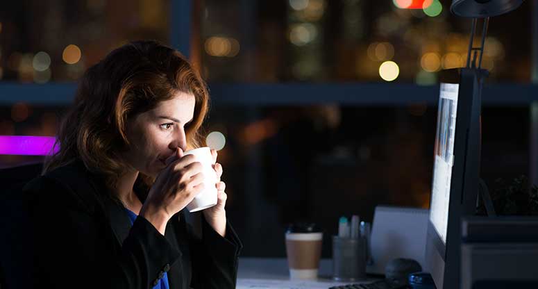 woman working at night in her office