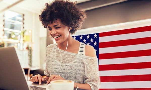 woman working from home with flag background