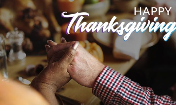 people giving thanks during thanksgiving dinner when working from home