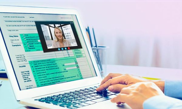 man filling out tax form and getting help from work from home customer service agent job