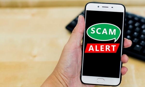 smart phone with the message scam alert