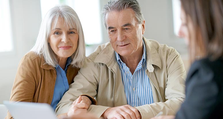 middle aged couple that work from home practice financial education