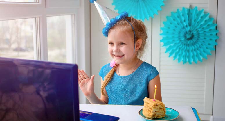 Little girl celebrating birthday via virtual manner during pandemic