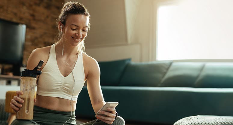 woman talking to work at home customer service agent after workout