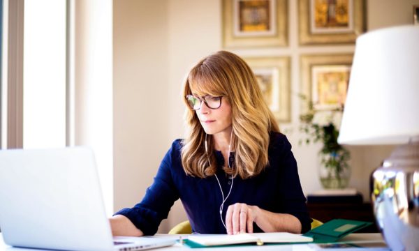 woman working from home getting budget for home business