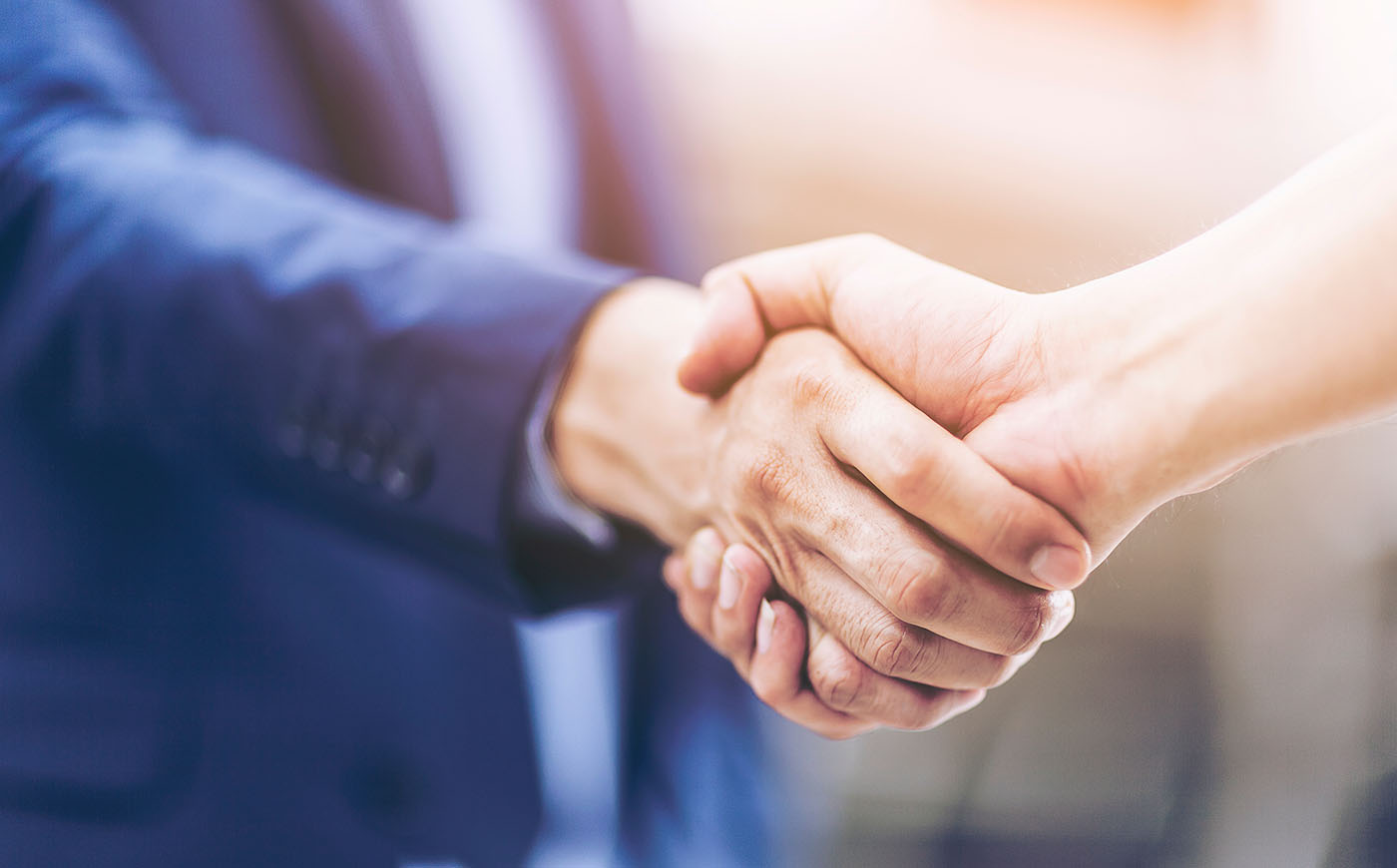 Close up of a handshake between two people