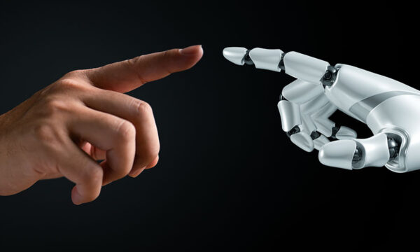 Two hands connecting fingertips, one human and one robot