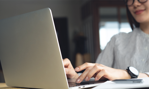 Young asian business woman working on laptop, surfing internet, remote work at coffee shop. Freelance lifestyle, online job, e-business concept